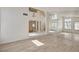 Bright living room featuring sleek light flooring, an open floorplan, and plenty of natural light at 2917 Broken Willow Cir, Las Vegas, NV 89117