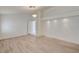 Spacious living room with light wood flooring and recessed lighting ready for your personal touch at 2917 Broken Willow Cir, Las Vegas, NV 89117