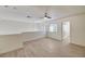 Bright living room featuring neutral walls, wood flooring, and a ceiling fan at 2917 Broken Willow Cir, Las Vegas, NV 89117