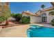 Backyard featuring a private pool, mature trees and plants, privacy wall and desert landscaping at 2917 Broken Willow Cir, Las Vegas, NV 89117