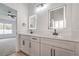 Bathroom featuring dual sinks with vanity, LED mirrors, and open access at 3104 Waterview Dr, Las Vegas, NV 89117