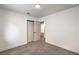 A clean bedroom features neutral carpet, paint, and trim, plus a closet and entry to another room at 3104 Waterview Dr, Las Vegas, NV 89117