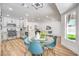 Bright open kitchen and dining area with hardwood floors, stainless steel appliances, and modern finishes at 3104 Waterview Dr, Las Vegas, NV 89117