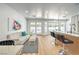 Inviting living room with hardwood floors, modern bar seating, white couch, outdoor view, and bright natural light at 3104 Waterview Dr, Las Vegas, NV 89117