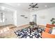 Spacious living room with hardwood floors, bright natural light, modern decor, and an open doorway to the entry at 3104 Waterview Dr, Las Vegas, NV 89117