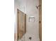 Modern walk-in shower featuring sleek tile work, glass enclosure, and contemporary fixtures at 3104 Waterview Dr, Las Vegas, NV 89117