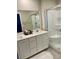 Modern bathroom featuring double sinks, shower, and neutral color palette at 330 Silva Pl, Henderson, NV 89011