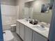 Bathroom features double sinks, modern fixtures, and a combined tub/shower at 330 Silva Pl, Henderson, NV 89011