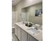 Bathroom featuring double sinks, modern fixtures, and a combined tub/shower at 330 Silva Pl, Henderson, NV 89011