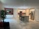 Open kitchen with stainless steel appliances, an island with seating, and tile flooring at 330 Silva Pl, Henderson, NV 89011