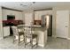 Modern kitchen with stainless steel appliances and breakfast bar seating at 330 Silva Pl, Henderson, NV 89011