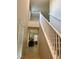 Well-lit staircase with white railings and neutral decor at 330 Silva Pl, Henderson, NV 89011