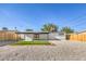 Spacious backyard featuring low-maintenance landscaping, a covered patio, and privacy fencing at 333 Rossmoyne Ave, North Las Vegas, NV 89030