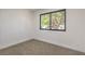 Well-lit bedroom with neutral carpeting and window views to the outdoors at 333 Rossmoyne Ave, North Las Vegas, NV 89030