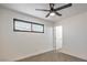 The bedroom has neutral-toned carpet, a window, and fresh white paint at 333 Rossmoyne Ave, North Las Vegas, NV 89030