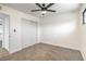A neutral bedroom with carpet, a ceiling fan, and a closet at 333 Rossmoyne Ave, North Las Vegas, NV 89030