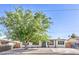 Charming single-story home with a well-maintained front yard and a lovely shade tree at 333 Rossmoyne Ave, North Las Vegas, NV 89030