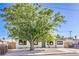 Charming single-story home with a well-maintained front yard and a lovely shade tree at 333 Rossmoyne Ave, North Las Vegas, NV 89030
