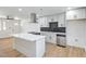 The newly renovated kitchen features stainless steel appliances and a center island at 333 Rossmoyne Ave, North Las Vegas, NV 89030