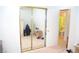 Bedroom featuring mirrored closet, bed, and ensuite bathroom with green shower curtain at 3519 W Red Coach Ave, North Las Vegas, NV 89031