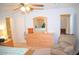 Spacious bedroom featuring wood dresser with mirror, chair, and bathroom access at 3519 W Red Coach Ave, North Las Vegas, NV 89031