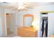 Bedroom with dresser, open closet, ceiling fan, and light colored wood furnishings at 3519 W Red Coach Ave, North Las Vegas, NV 89031