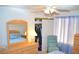 Bedroom featuring bed, dresser with mirror, chair, window, and closet at 3519 W Red Coach Ave, North Las Vegas, NV 89031