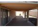 View of the patio and backyard, with manicured landscaping at 3519 W Red Coach Ave, North Las Vegas, NV 89031