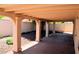 Wide angle shot of covered patio with landscaped backyard at 3519 W Red Coach Ave, North Las Vegas, NV 89031