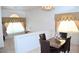 Upstairs dining area with marble table and decorative window curtains, open to living space at 3519 W Red Coach Ave, North Las Vegas, NV 89031