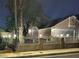 Well-maintained single-story residence with attached two-car garage, arched windows and decorative fence at 3519 W Red Coach Ave, North Las Vegas, NV 89031
