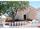 Charming home exterior with decorative fence, lush landscaping, and a well-maintained front yard at 3519 W Red Coach Ave, North Las Vegas, NV 89031