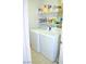 Laundry room featuring white washing machine, dryer, and shelving for storage at 3519 W Red Coach Ave, North Las Vegas, NV 89031