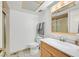 Well-lit bathroom with a single sink vanity, ample counter space, and a shower at 3753 Heritage Ave, Las Vegas, NV 89121