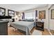 Cozy bedroom with hardwood floors, a double bed, and bright natural light at 3753 Heritage Ave, Las Vegas, NV 89121