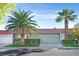 Charming single-story home featuring desert landscaping, a tile roof, and an attached two-car garage at 3753 Heritage Ave, Las Vegas, NV 89121