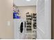 Functional laundry room equipped with modern washer and dryer units and storage solutions at 3753 Heritage Ave, Las Vegas, NV 89121