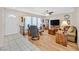 Inviting living room with hardwood flooring, bright windows, and an open floor plan at 3753 Heritage Ave, Las Vegas, NV 89121