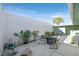 Large private patio area features a seating area, garden, and a tall perimeter wall at 3753 Heritage Ave, Las Vegas, NV 89121