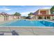 Community swimming pool featuring sparkling blue water, a spacious deck, and gated entries at 3753 Heritage Ave, Las Vegas, NV 89121