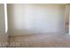 Spacious living room with neutral colored carpet at 3995 Visby, Las Vegas, NV 89119