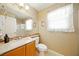 Bright bathroom features a large mirror, vanity with sink, and a shower with decorative mosaic tile accents at 419 Alonzo Ct, Las Vegas, NV 89123