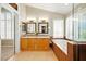 Bright bathroom with dual sinks, soaking tub, and walk-in shower at 419 Alonzo Ct, Las Vegas, NV 89123