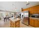 Bright, open kitchen with stainless steel appliances and a large island seamlessly connected to the dining and living areas at 419 Alonzo Ct, Las Vegas, NV 89123