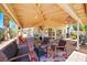 Charming covered patio with outdoor furniture and brick flooring, perfect for outdoor dining and relaxation at 419 Alonzo Ct, Las Vegas, NV 89123
