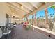 Inviting covered patio with ample seating, brick flooring, and well-maintained landscaping offering a tranquil outdoor space at 419 Alonzo Ct, Las Vegas, NV 89123