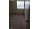 Bedroom features neutral carpet, bars on the window for security at 4231 White Sands Ave, Las Vegas, NV 89121