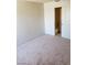 Bedroom with neutral carpet and ensuite bathroom at 4231 White Sands Ave, Las Vegas, NV 89121