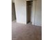 Bedroom with sliding closet doors, carpet, and ample room at 4231 White Sands Ave, Las Vegas, NV 89121