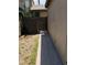Exterior view showcasing a weathered fence and gated access with desert foliage around the home at 4231 White Sands Ave, Las Vegas, NV 89121